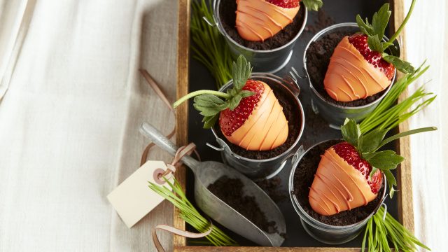 Chocolate covered strawberry carrots in chocolate dirt